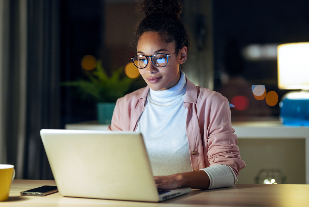 Woman using business listing service on laptop.